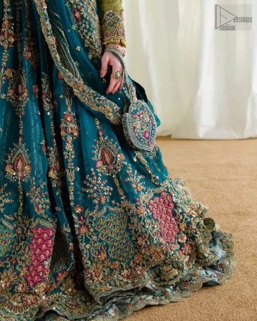 Lower hemline and wide flare of teal double-layer Rajistaani lehenga.