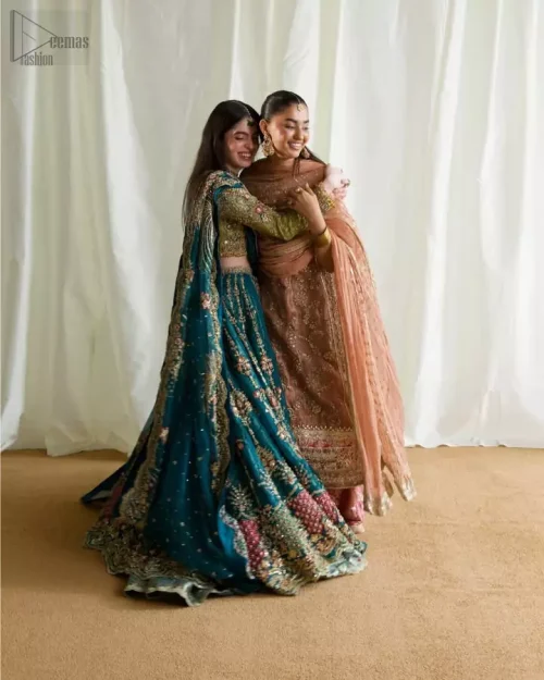 Styled bride wearing olive blouse and teal Rajistaani lehenga at a festive venue.