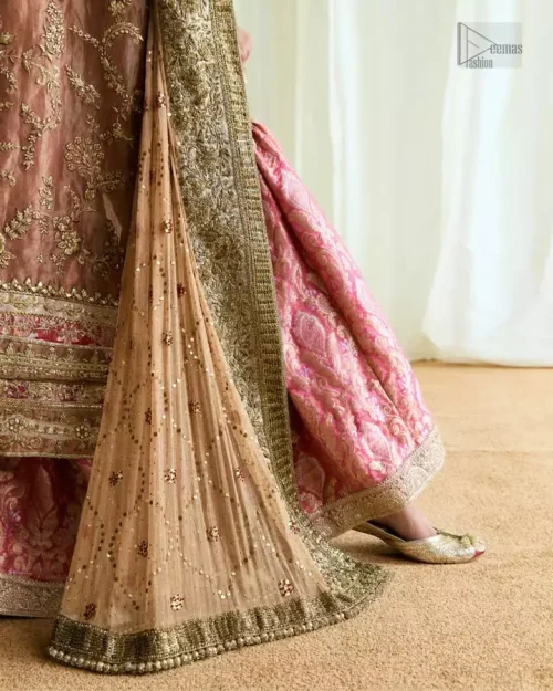 Hand embroidery with dabka, stones, pearls, and Swarovski crystals on peach outfit.