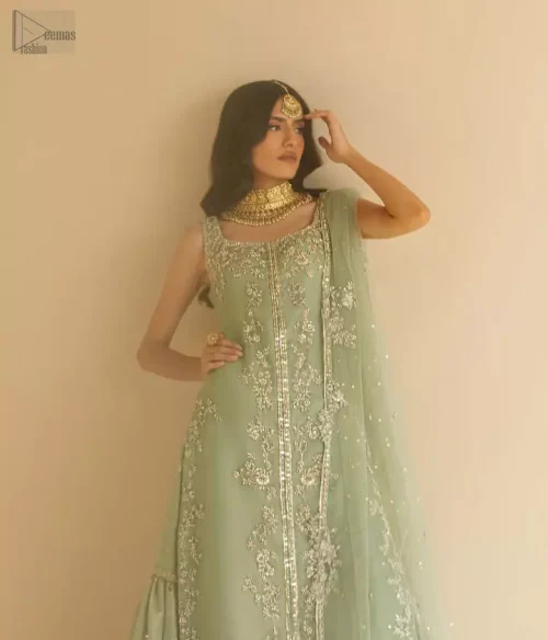 Sage green long organza shirt paired with matching gharara and net dupatta for intimate Nikkah guest wear.