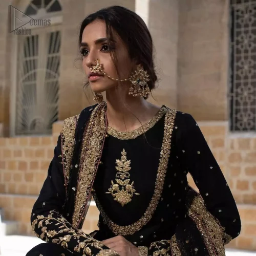 Round neckline and golden embroidery on black organza pishwas bodice.