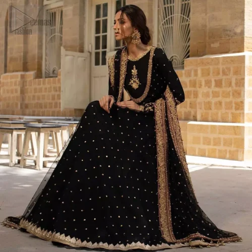 Angled movement shot of black organza party pishwas with golden zardozi embroidery.