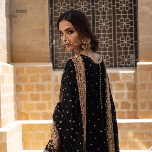 Rear view of black organza party pishwas showing fluid drape and structured bodice.