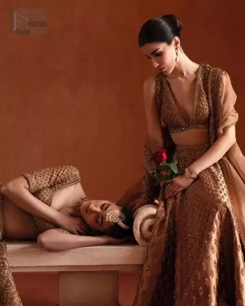 Hand embroidery with dabka, stones, pearls, and Swarovski crystals.