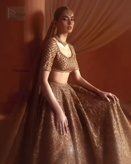 Sweetheart neckline and antique embroidery on bronze raw silk blouse.