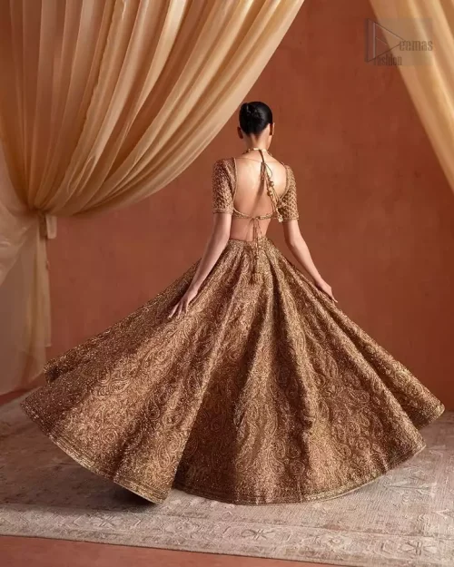 Back view of bronze raw silk bridal blouse and lehenga with antique embroidery.