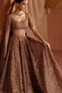 Complete bronze lehenga, blouse, and dupatta set flat lay.