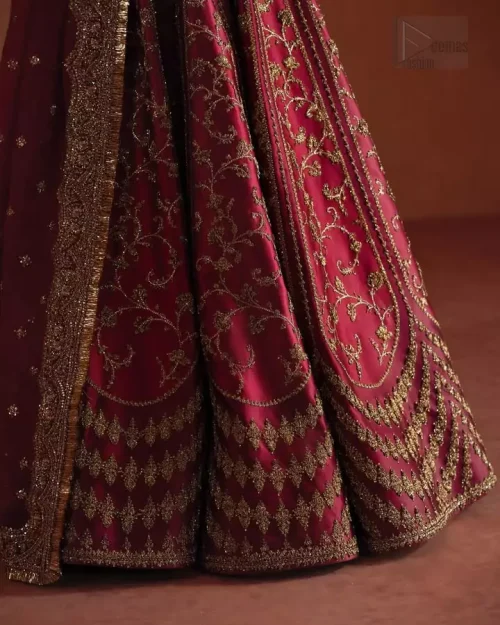 Geometric Pattern Detail: A detailed shot of the unique geometric patterns on the raw silk lehenga, elevating its contemporary magnificence.