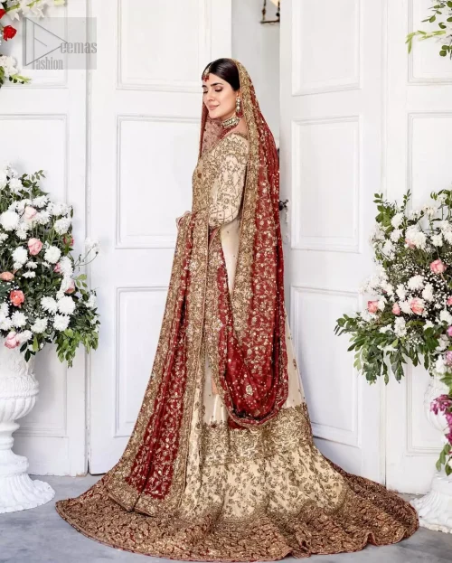 Dynamic three-quarter action shot of ivory and red reception bridal outfit.