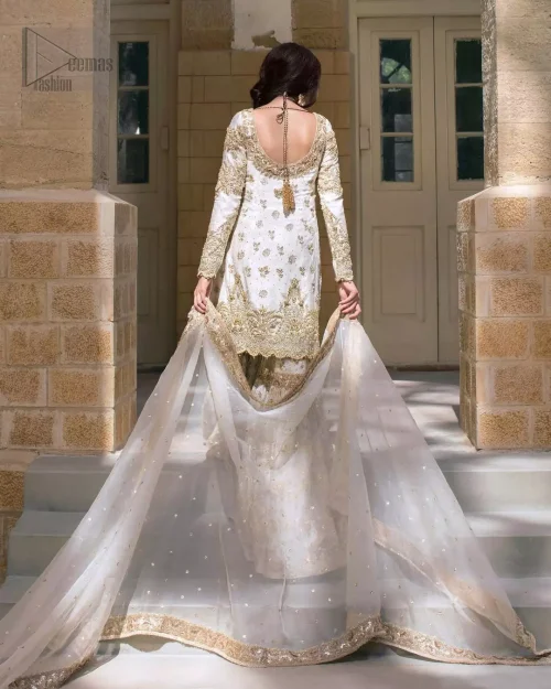 Rear view of ivory short shirt and katan organza wide-flare gharara.