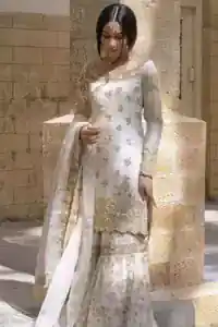 Ivory raw silk short shirt and katan organza gharara styled for a traditional Nikkah ceremony.