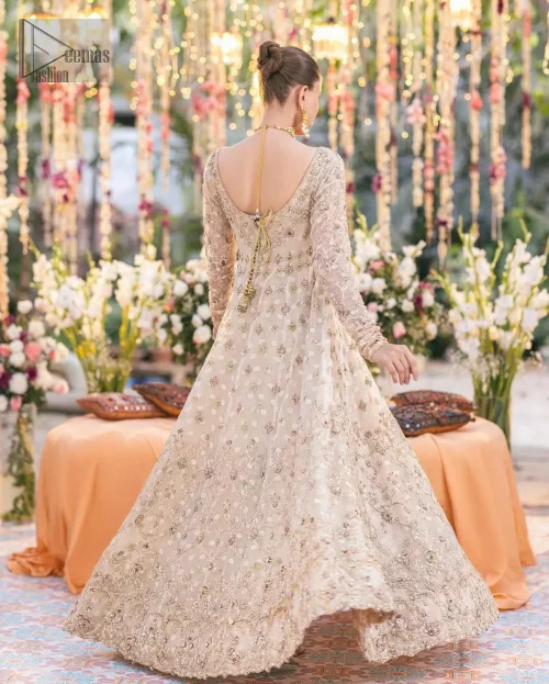 Rear view of ivory kundan zari pishwas showing clean lines and structured panels.
