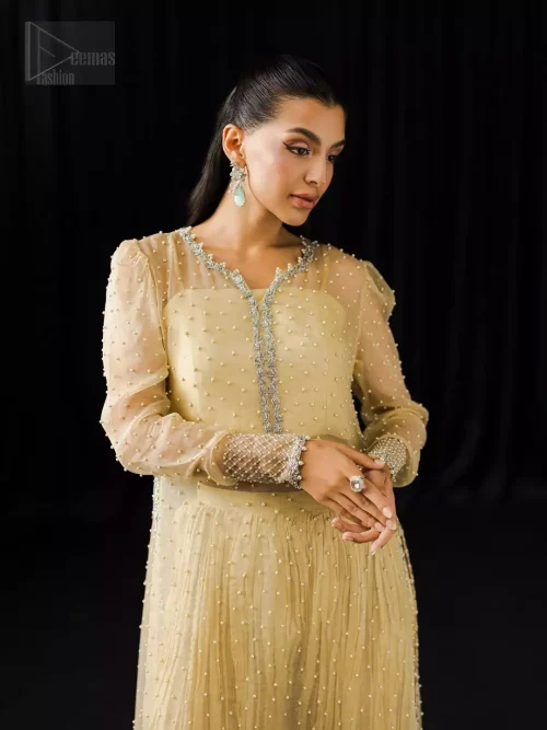 Light yellow long organza shirt paired with crushed Dhaka pants and ice blue dupatta for daytime mehndi events.