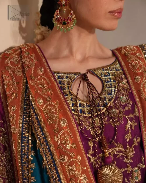 Magenta raw silk palazzo pants with golden antique embroidered borders.