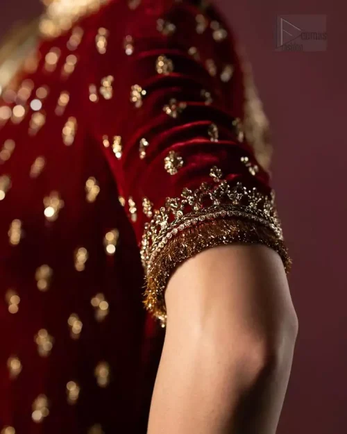 Jewel neckline and kiran lace detailing on maroon velvet short shirt.