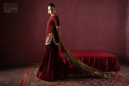 Rounded hemline with kiran lace on maroon velvet short shirt.
