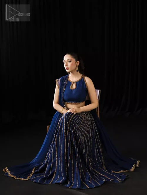 Pure silk and chiffon shimmer like midnight waves when the Navy Blue Lehenga Blouse carries its mesmerising depth and grandeur.
