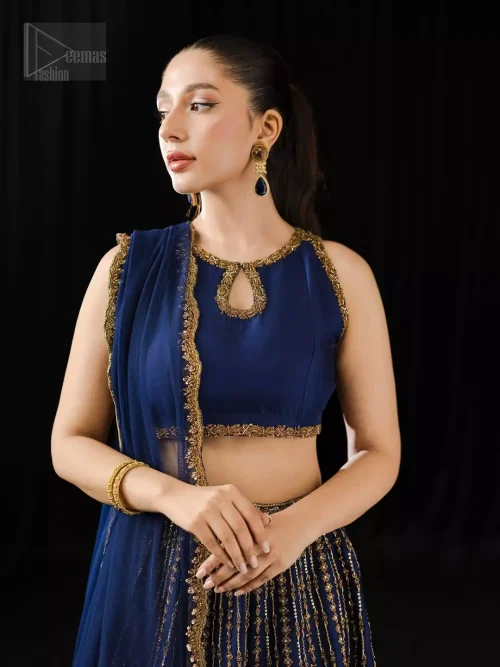 This ensemble bridges tradition and allure, and is perfect for mehndi or nikah celebrations under golden light.