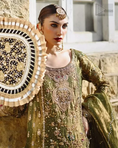 Olive green long shirt with palazzo pants crafted in katan banarsi jamawar and pure tissue silk, highlighted by silver and