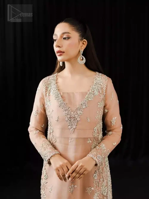 Pale peach floor-length organza shirt paired with raw silk cigarette pants for modern formal wear.