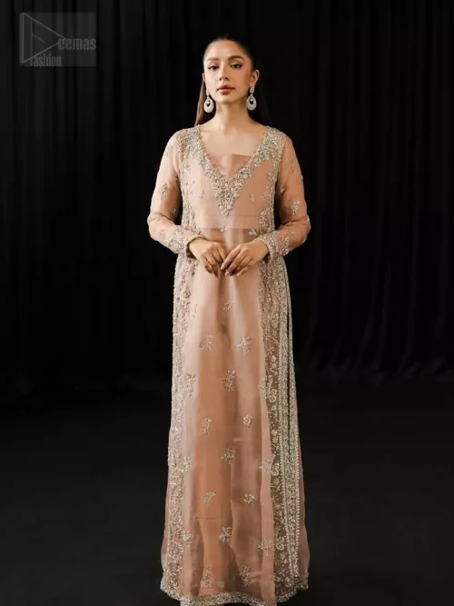 Square neckline and fine embroidery detail on pale peach organza shirt.