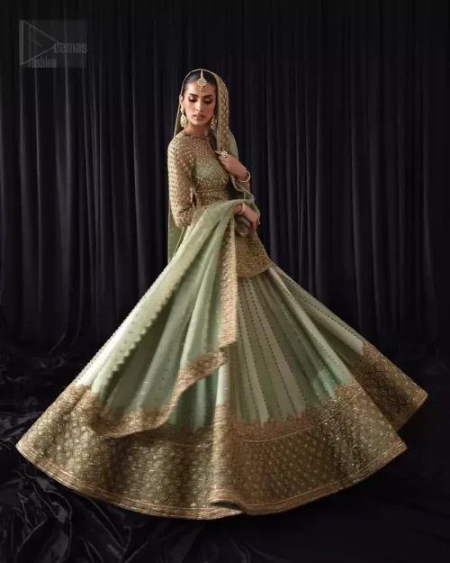 Three-quarter action shot of pistachio short shirt and lehenga in motion.