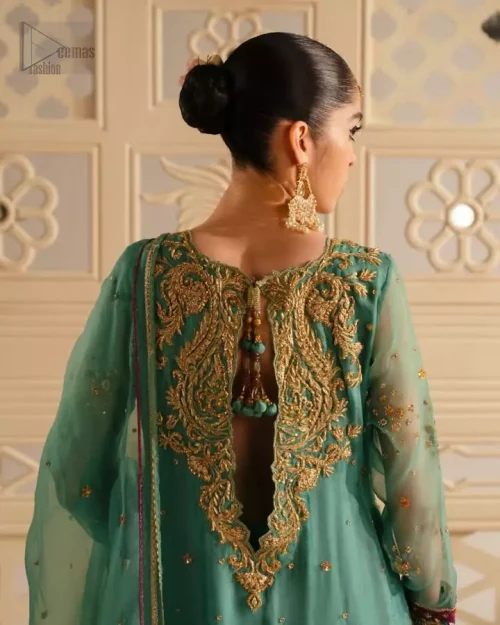 Rear view of sea green front-open shirt and crushed sharara ensemble.