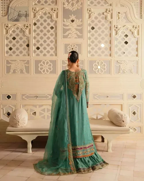Hand embroidery with dabka, stones, and Swarovski crystals on sea green dress.