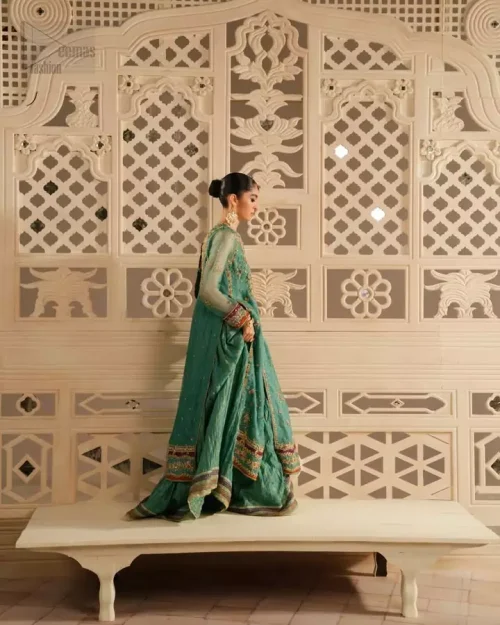 Sea green organza dupatta with sequins spray and four-sided embroidered borders.