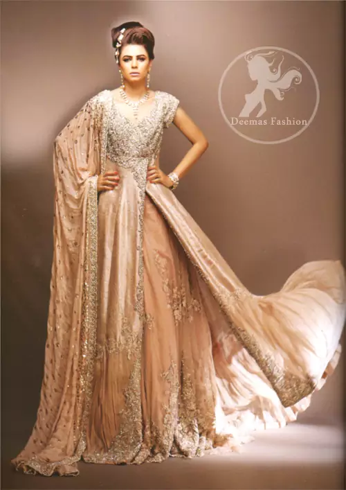 Pale peach side open double layer bridal wear maxi dress with heavy embroidered bodice and border on side slit. Large motifs implemented on inner layer.
