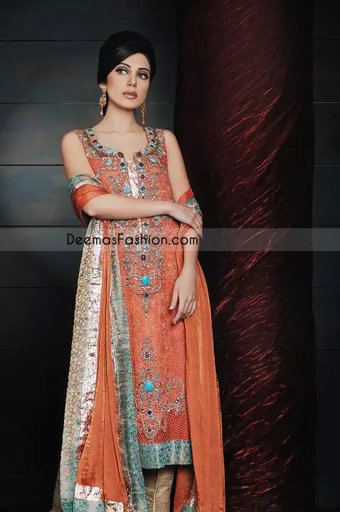 Rust self jamawar long shirt is fully embellished with beautiful embroidery on neck line. Embellishment works includes thread,tilla, beads and stone work. Double tone, sea green & rust self jamawar fabric is used on hemline border.